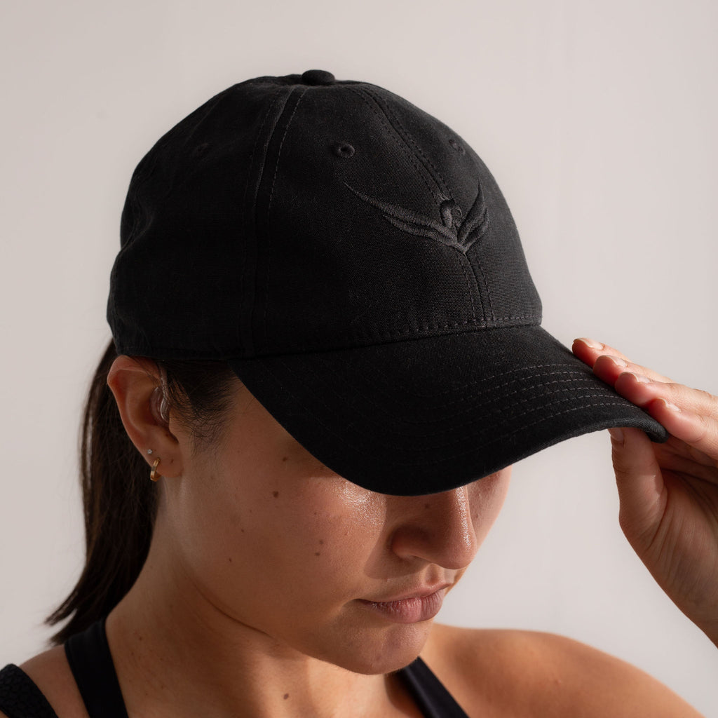 Wild Warrior cap with black wings logo embroidery, front view.