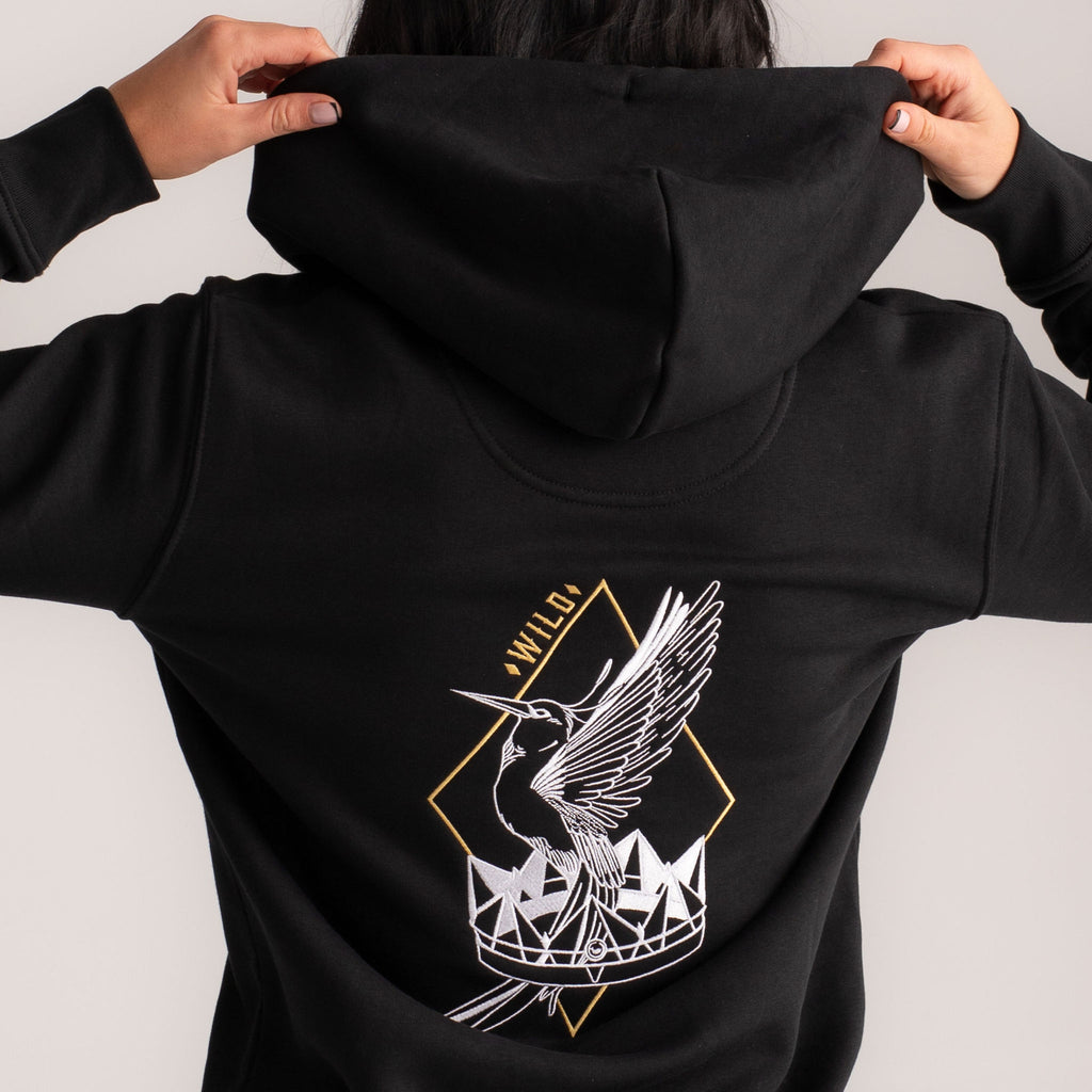 Wild Warrior zip-up hoodie with graceful bird & crown embroidery. Image view from the back with embroidery detail.